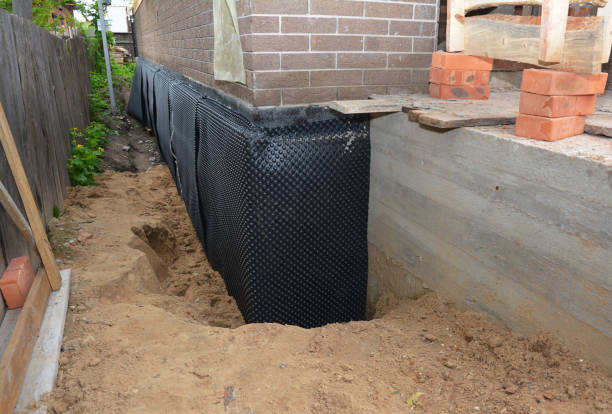 Happy homeowners after waterproofing job in Leonidas